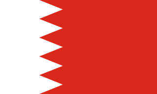 The flag of Bahrain has a red field. On the hoist side, it features a white vertical band that spans about one-third the width of the field and is separated from the rest of the field by five adjoining fly-side pointing white isosceles triangles that serve as a serrated line.