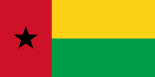 The flag of Guinea-Bissau features a red vertical band on its hoist side that takes up about two-fifth the width of the field, and two equal horizontal bands of yellow and green adjoining the vertical band. A five-pointed black star is centered in the vertical band.