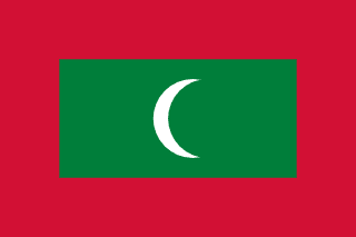 The flag of Maldives has a red field, at the center of which is a large green rectangle bearing a fly-side facing white crescent.